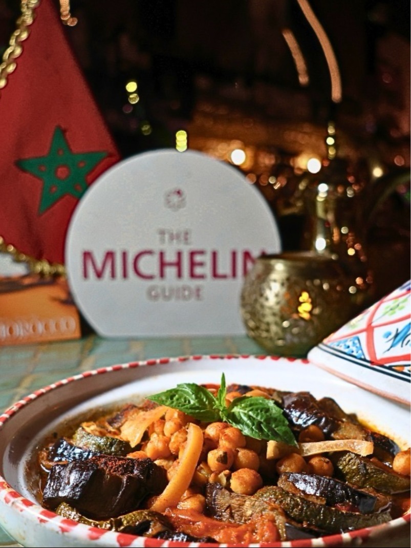 Moroccan tagine slow-cooking with aromatic halal-certified spices at Moltaqa Vancouver